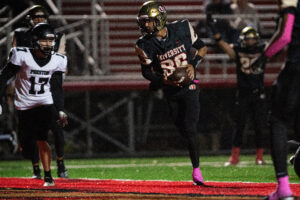University's Glenn Brown accounts for six touchdowns to lead Hawks past Preston 42-35